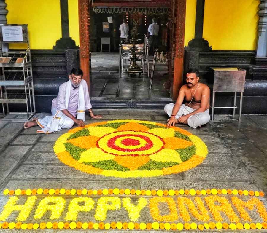 Morning at Sree Guruvayurappan temple near Kalighat began with the priests decorating a ‘pookalam’ with bright and fresh flowers at the entrance wishing devotees ‘Happy Onam’  