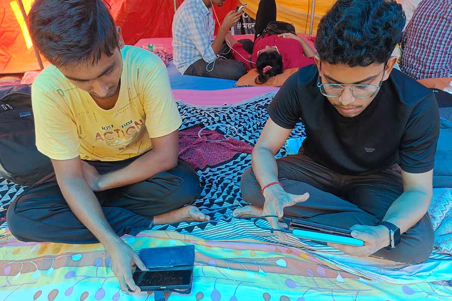 Rahul Hazra (right) watching the Supreme Court hearing with his friend 