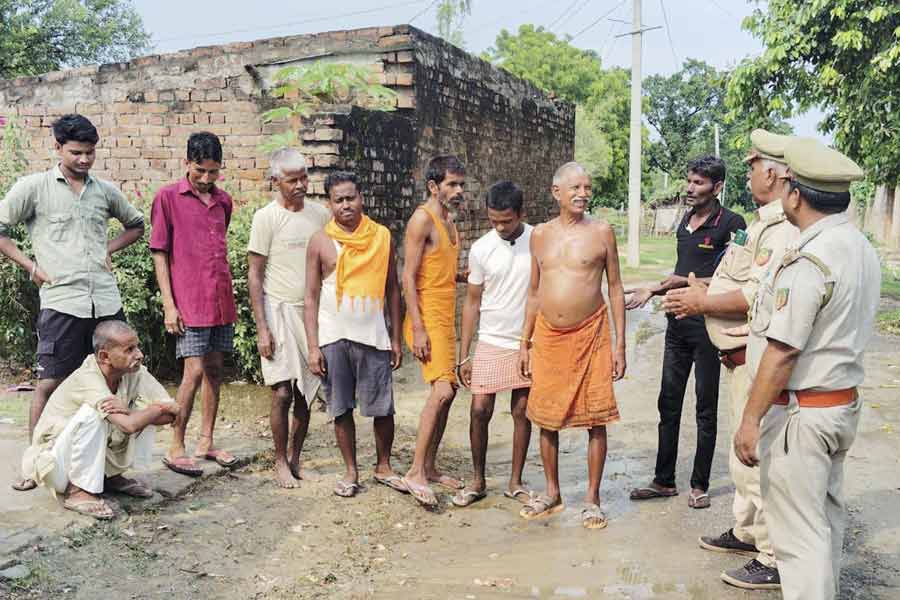 Police personnel interacts with locals during the ‘Operation Bhediya’ at an area in Bahraich district