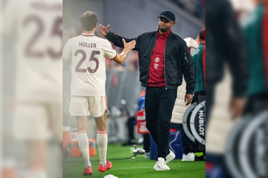 Bayern Munich manager Vincent Kompany with Thomas Muller.