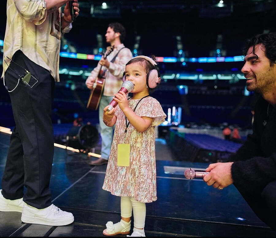 Malti tried her hand at singing with Nick, Joe and Kevin on stage during one of their practice sessions before the concert.