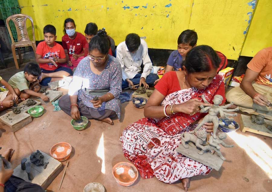 Idolmaker Mala Pal trains young students at her workshop in Kumartuli ahead of Durga Puja   