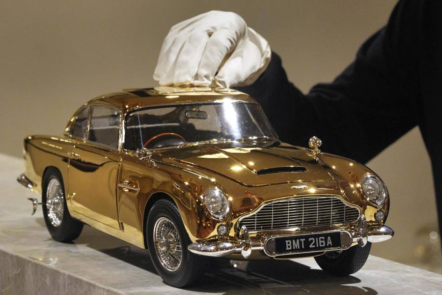 A view of 24-carat gold-plated model of James Bond's Goldfinger Aston Martin DB5, one of only seven made in museum quality 1:8 scale by British car kit makers Agora Models, on display at Burlington Arcade in central London.