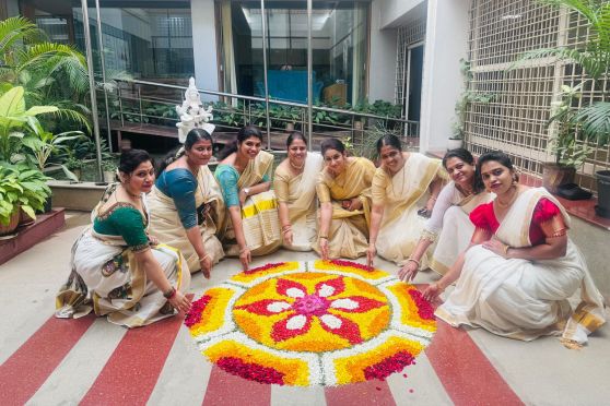 One of the most beautiful and symbolic elements of Onam is the Pookkalam—intricate floral rangoli designs made from fresh flowers. This year’s Pookkalam competition saw tremendous participation from students across all departments. Each group showcased their creativity by designing vibrant floral arrangements that reflected the spirit of Onam, with every petal carefully placed to symbolize harmony and peace. The sight of these colorful designs spread across the campus lawn was nothing short of breathtaking