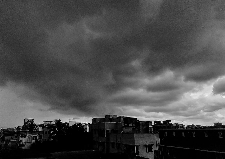 With a twin low atmospheric pressure system brewing in the Bay of Bengal, the Kolkata sky witnessed thick, black clouds on Tuesday