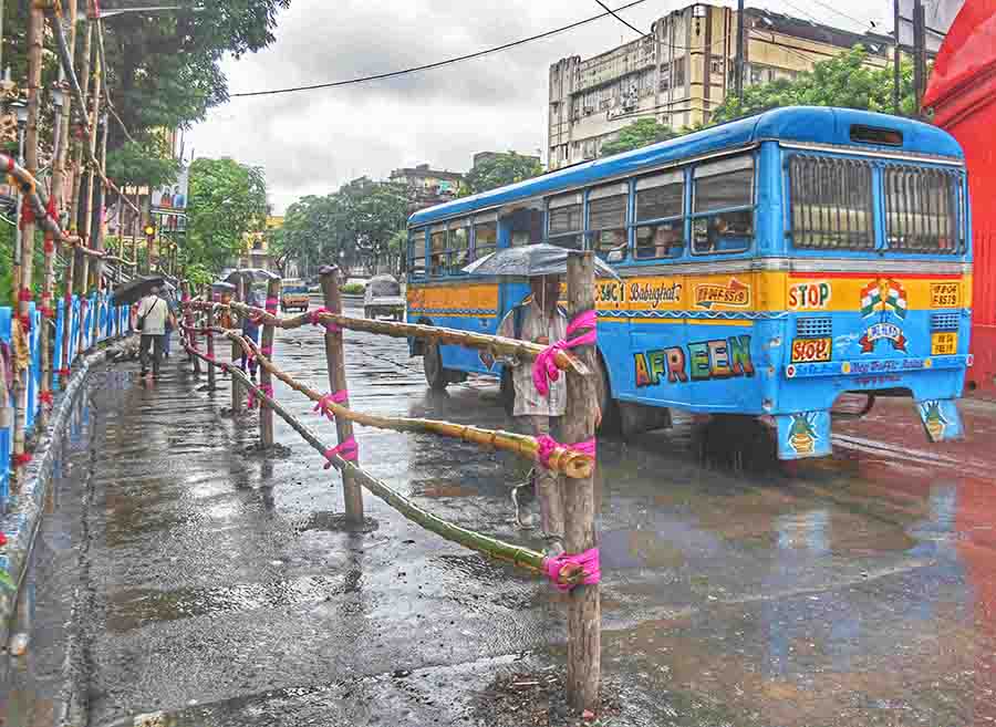 Road barricades for safe pedestrian movement during Durga Puja set up on Chittaranjan Avenue