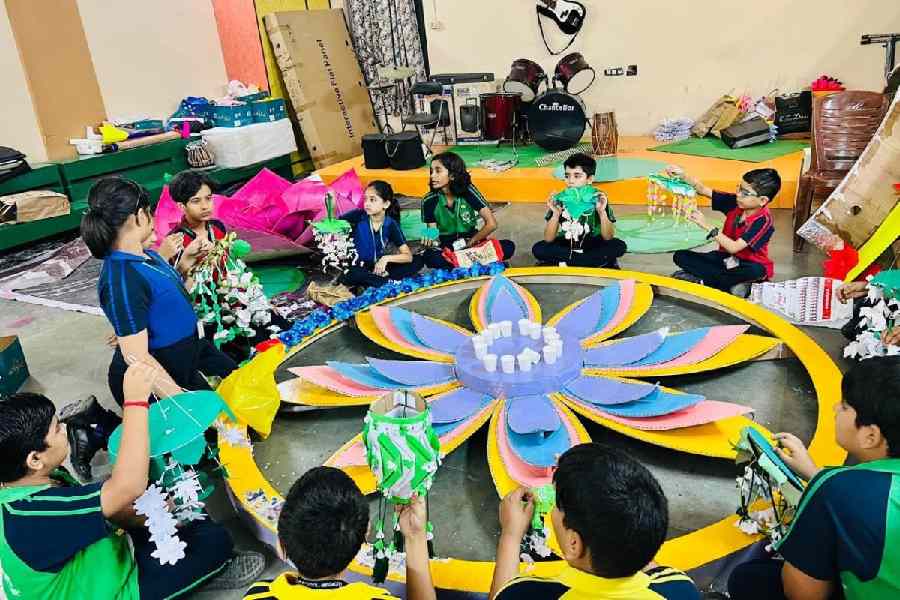 Students of DPS, Megacity, help out in the Durga Puja decorations at their school's activity room   