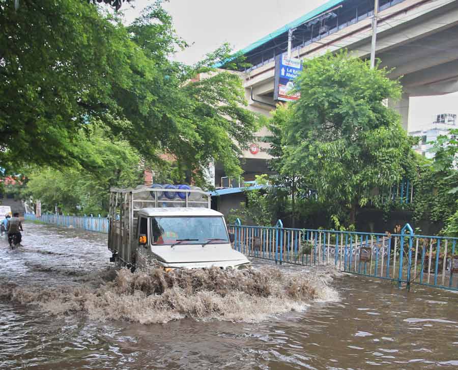 Waterlogging was reported from several low-lying areas of the city. In picture, heavy waterlogging on the street near Hiland Park on Thursday afternoon 