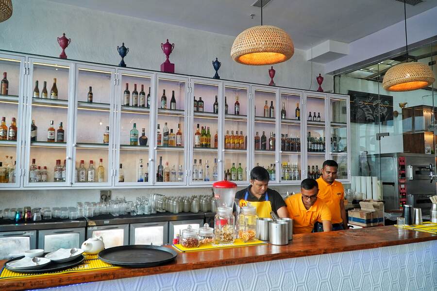 The bar is stocked and the bartenders are back, shaking and stirring up delectable cocktails for the patrons. The white background of the bar adds to the soothing atmosphere at Hoppipola making it the best place to get a drink after a long week at work. With new cocktails to try the bar at Hoppipola should be on your list of things to do this Puja