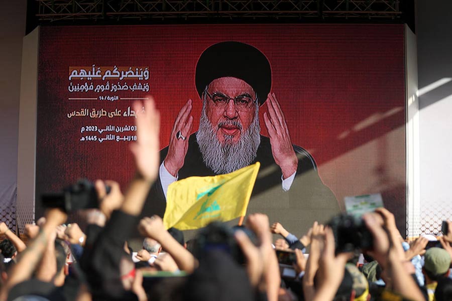 Lebanon's Hezbollah leader Sayyed Hassan Nasrallah appears on a screen as he addresses his supporters during a ceremony to honour fighters killed in the recent escalation with Israel, in Beirut's southern suburbs on November 3, 2023.