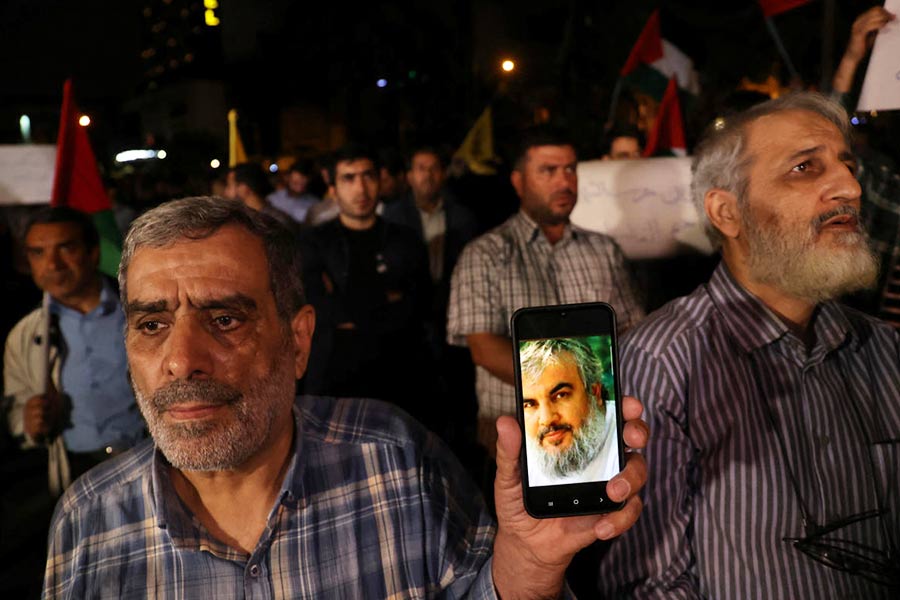 A protester shows a picture of Hezbollah leader Sayyed Hassan Nasrallah on his mobile phone during an anti-Israel protest following an Israeli strike on Lebanon, in Tehran, Iran, September 28, 2024.