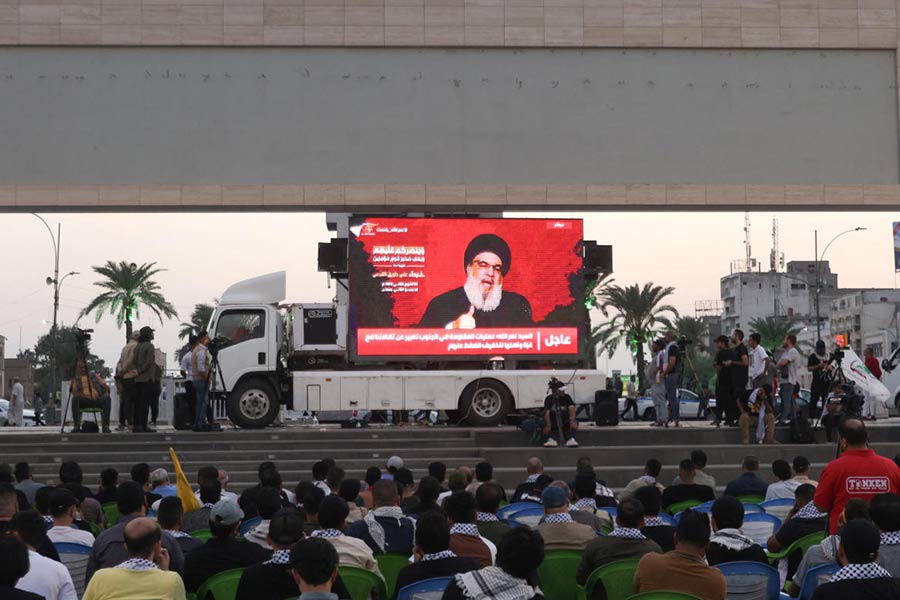 Supporters of Iraqi Shi'ite armed groups gather in Baghdad's Tahrir Square to watch a speech by Hezbollah leader Nasrallah in Baghdad, Iraq on November 3, 2023.