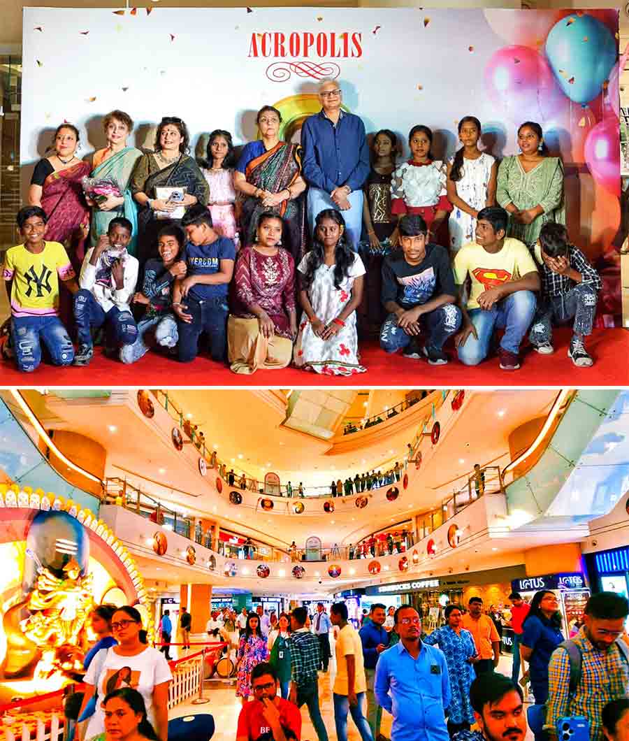 (Top) Acropolis Mall in Kasba’s Rajdanga celebrated its 9th birthday in style on September 25. Sushil Mohta, chairman of Merlin Group and developer of the leading state-of-the-art shopping destination, distributed new clothes among children from Pathchala in presence of Rukmini Paul, president, Pathchala, and Subhadip Basu, general manager of the mall and (above) shoppers made the most of a rainy day at the mall)