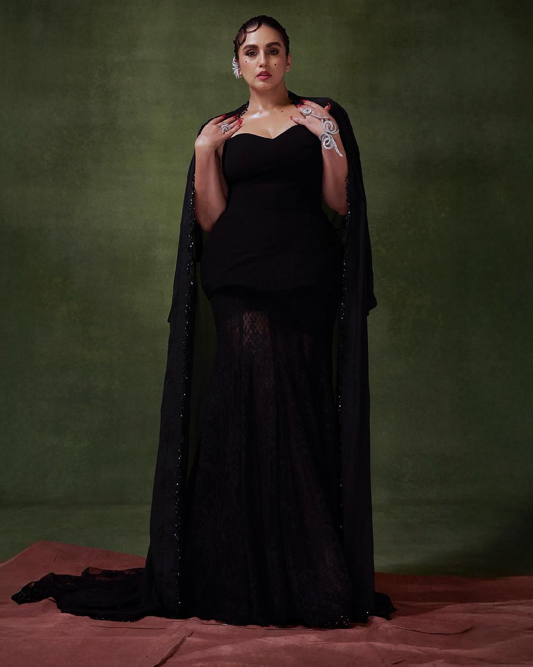 Huma Qureshi stunned in a black sheer gown with a cape draped across her shoulder. The actress is currently gearing up for the release of her upcoming drama series Maharani Season 4. 