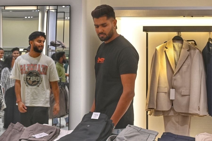 Harshit Rana looking at some formal pants for when he needs to suit up for a party