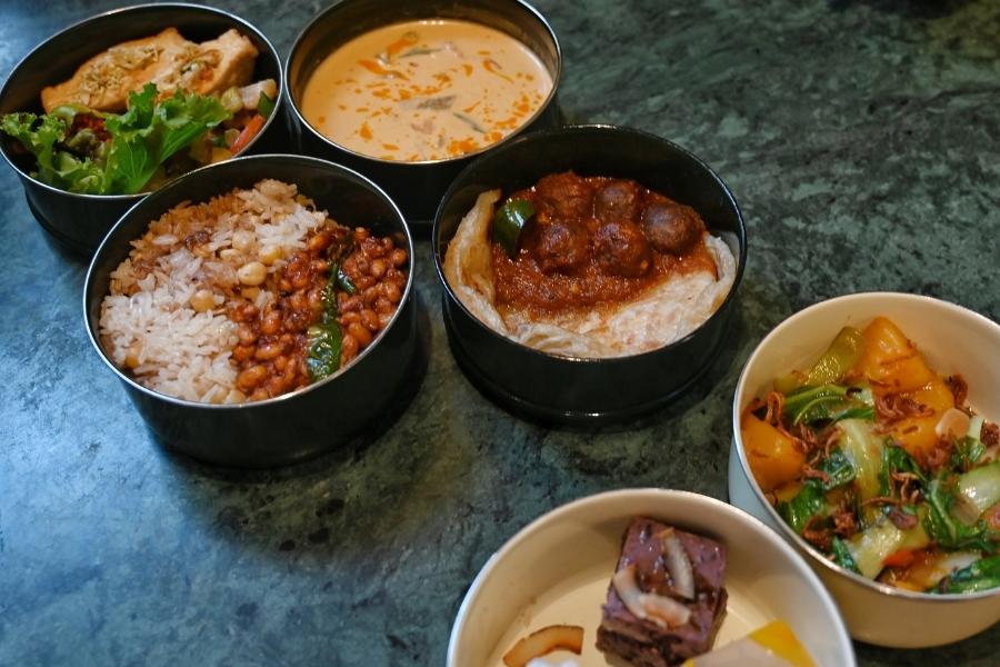 The centrepiece of the New Year menu is the tiffin meal for two persons (priced at Rs 1,800 plus taxes) served in a special enamel multi-tiered tiffin made by Burmese artisans