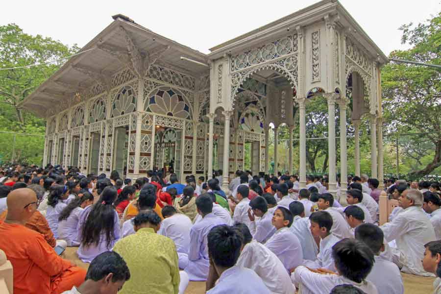 Students and teachers of Visva-Bharati University along with visitors take part in 'Poila Boisakh' or Bengali New Year celebrations at Upasana Griha, Santiniketan in Birbhum district of West Bengal.