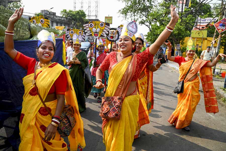 Women dance as they participate in 'Mangal Shobhajatra' to mark the first day of Bengali New Year in Kolkata.