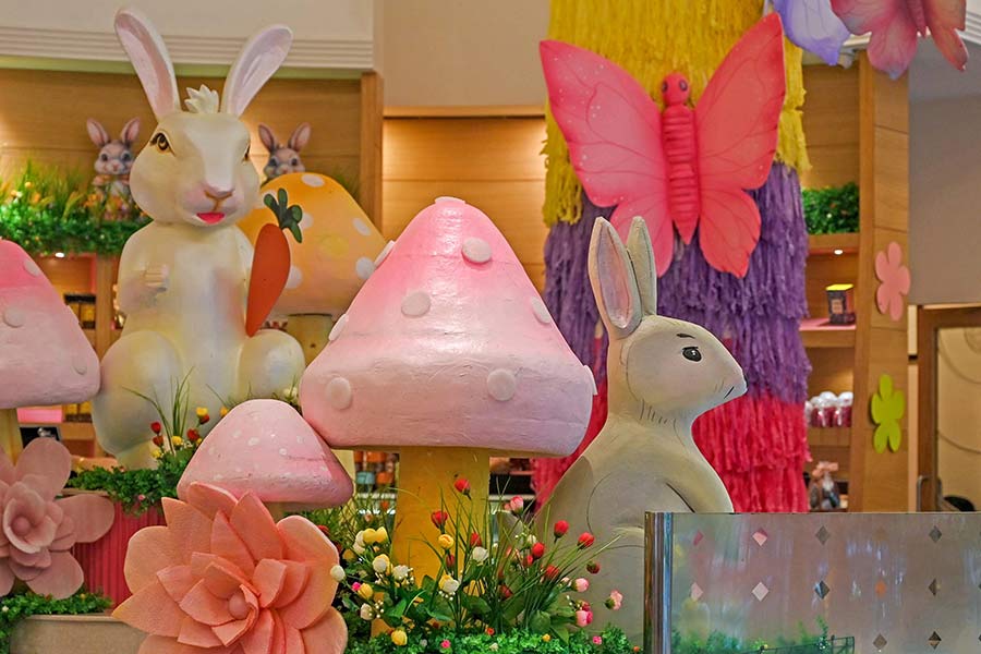 As you enter the confectionery, you are greeted by giant bunnies, and a flowering garden of wonders