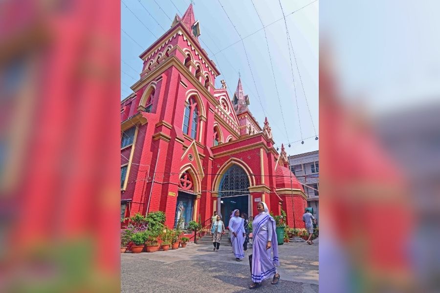 Nuns exit St Teresa’s Church on the morning of Good Friday  
