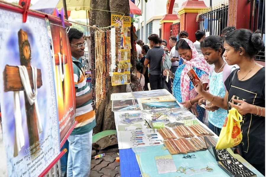 Rosaries and religious posters being sold at stalls outside St Teresa Church 