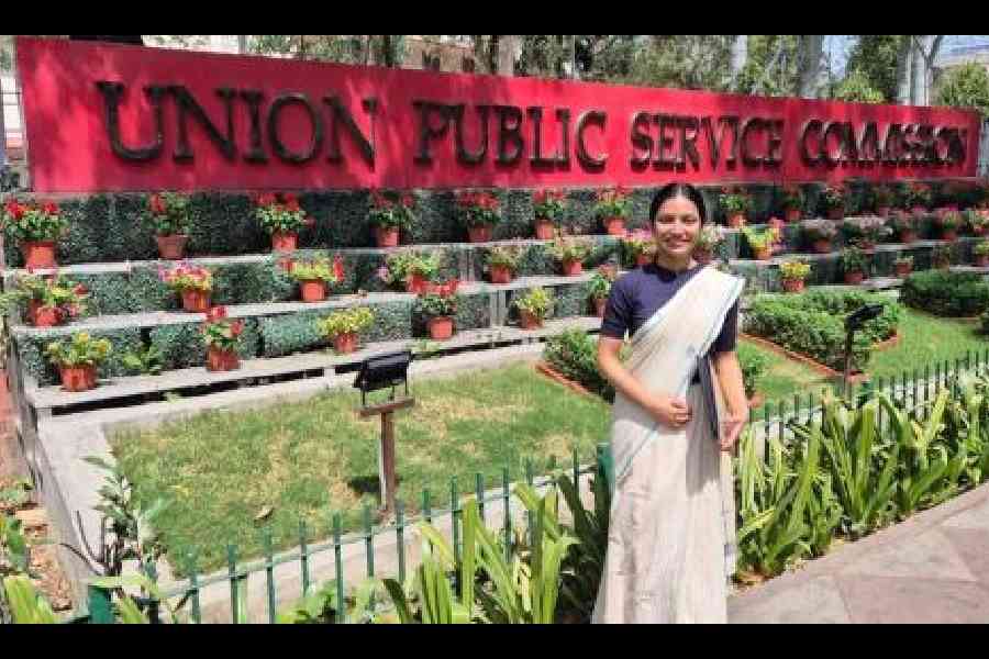 Meghna Chakravorty of AK Block poses in front of the Union Public Service Commission office in Delhi