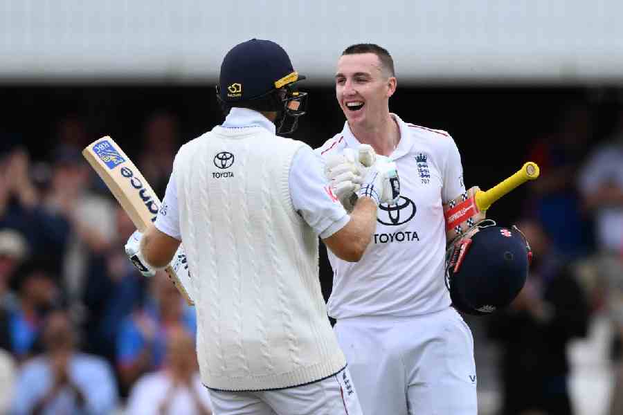 Harry Brook of England celebrates scoring his 100 with Joe Root during day four of the Fifth Test Match between England and India at The Kia Oval.