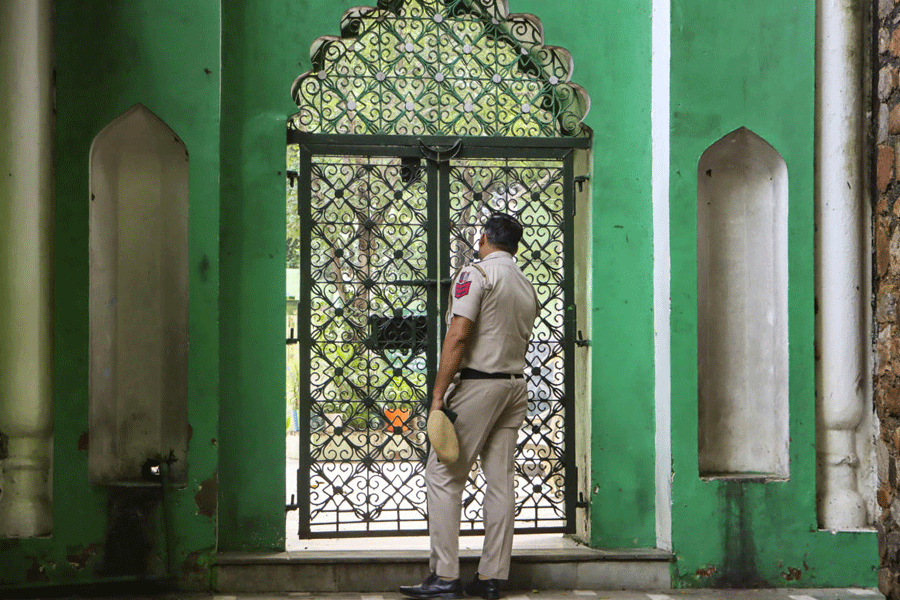 A police personnel at the site after roof of two adjacent rooms of a dargah near the Humayun's Tomb collapsed on Friday killing six people, in New Delhi, Saturday, Aug. 16, 2025.