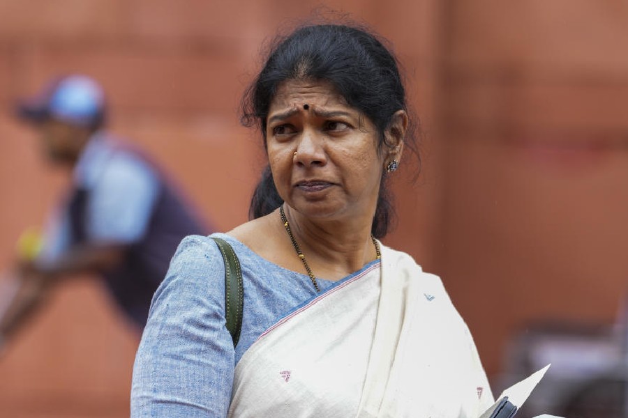 People gather as Enforcement Directorate searched premises linked to Tamil Nadu Minister and DMK leader I Periyasamy and his family as part of a money laundering investigation, in Dindigul, Saturday, Aug. 16, 2025.