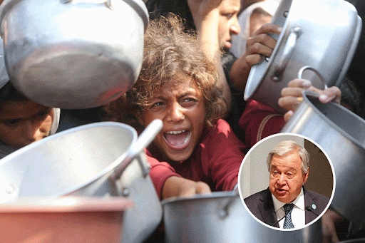 A child reacts surrounded by pots as Palestinians wait to receive food from a charity kitchen in Khan Younis, southern Gaza Strip