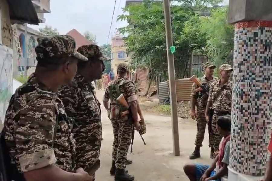 CRPF jawans near TMC MLA Jiban Krishna Saha's home at Burwan in Murshidabad on Monday.