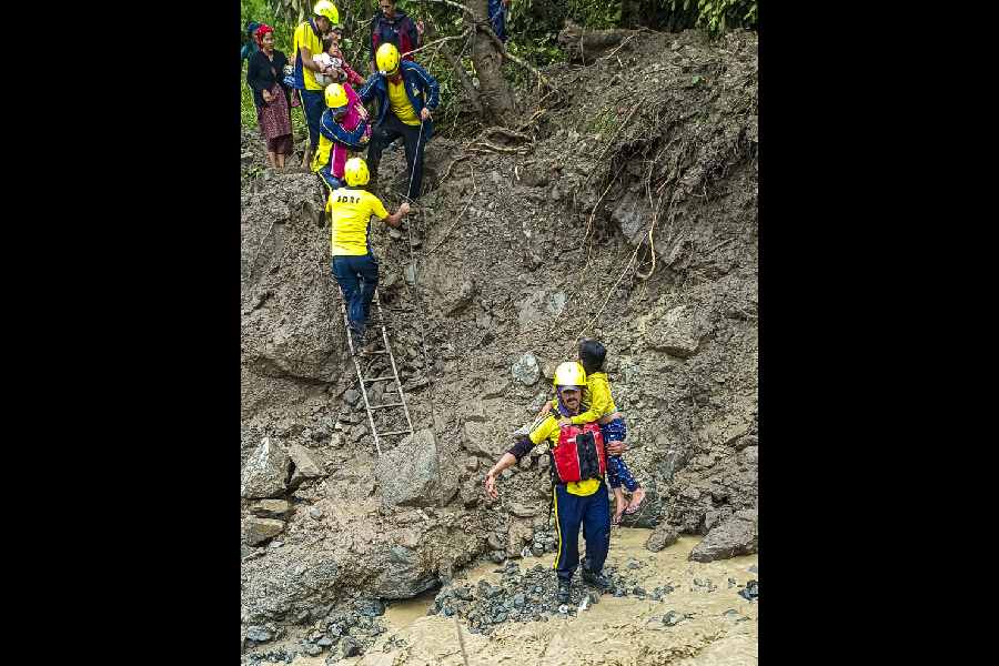 SDRF personnel during a search and rescue operation at a cloudburst-hit village, in Rudraprayag district, Uttarakhand, Friday, Aug. 29, 2025.