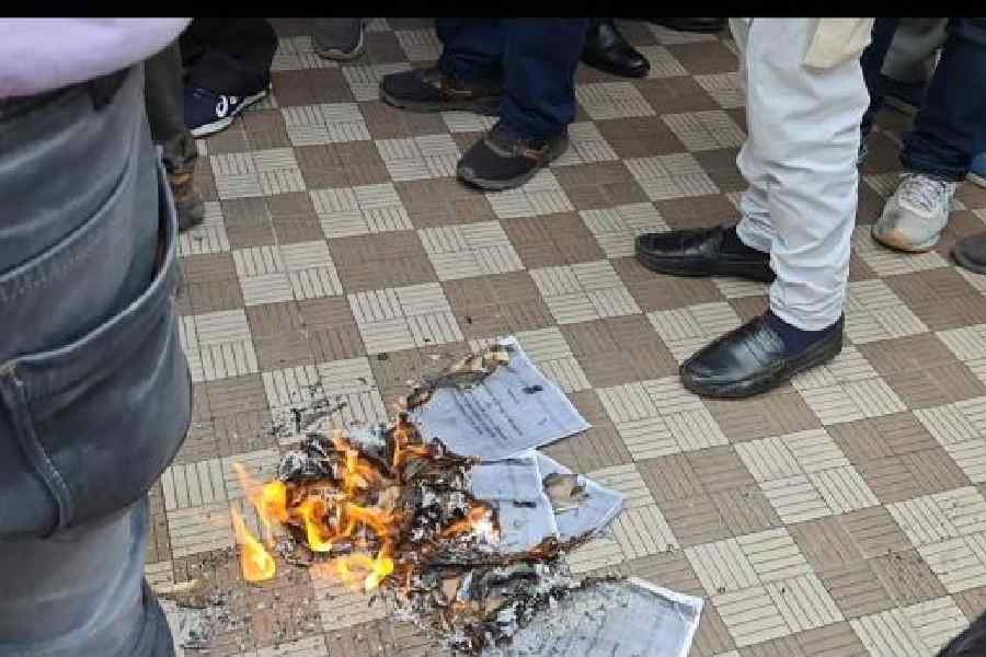 Copies of the GoM report being burnt in Guwahati on Sunday
