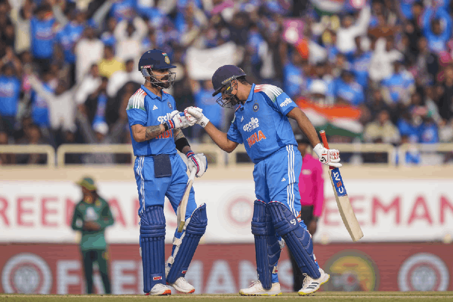 India's Virat Kohli, left, celebrates his half century with Rohit Sharma during the first ODI cricket match of a series between India and South Africa, at JSCA International Stadium Complex, in Ranchi, Jharkhand, Sunday, Nov. 30, 2025.