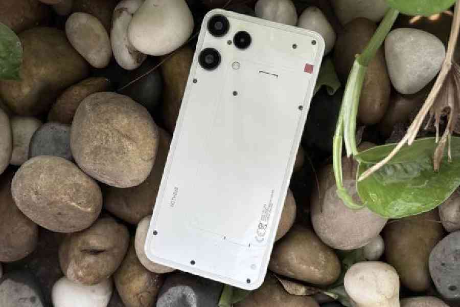 The Nothing Phone (3a) Lite is recognisable as part of the Nothing family. The transparent glass back shows a few screws and what looks like a battery.  Pictures: Mathures Paul