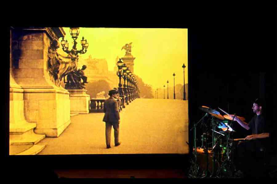 Stephane Scharle plays on stage during the screening of the silent film Paris Qui Dort