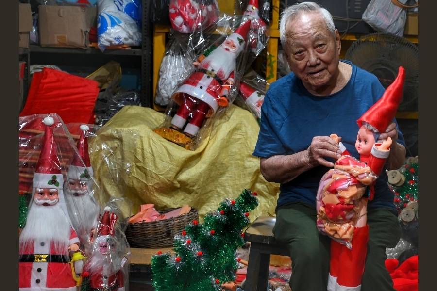 Ninety-four-year-old CH Chang works in a dim workshop on Rafi Ahmed Kidwai Road, handcrafting Santa Claus dolls and Christmas trees