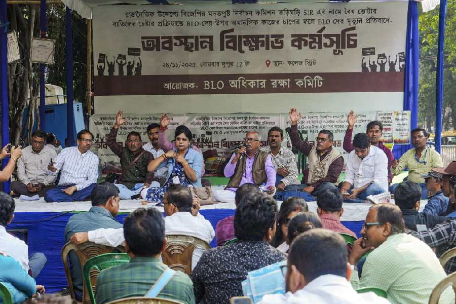 BLOs, under the banner of BLO Adhikar Raksha Committee, stage a demonstration to protest against alleged excessive workload during the SIR of electoral rolls, outside the chief electoral officer’s office in Calcutta on Tuesday.