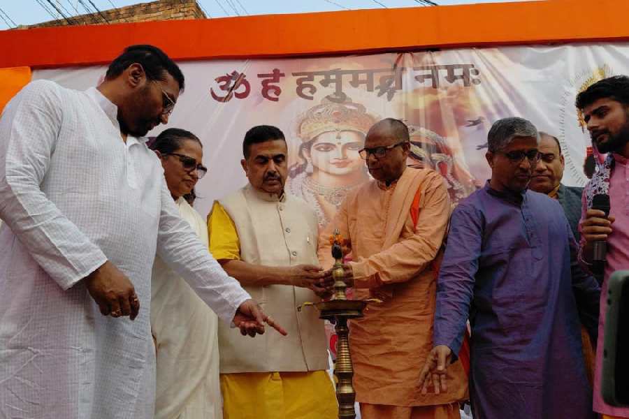 Suvendu Adhikari, with others, during the inauguration of the 35-foot-high gate that features the Hanuman statue in Malda on Tuesday.