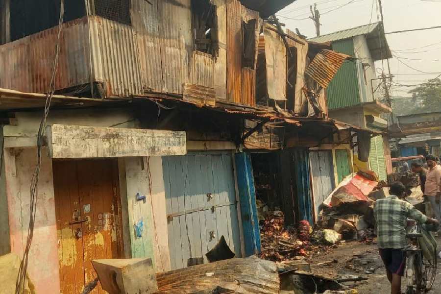 Remains of the shops burnt in Monday evening’s blaze at Burra Bazar in Alipurduar town on Tuesday morning.