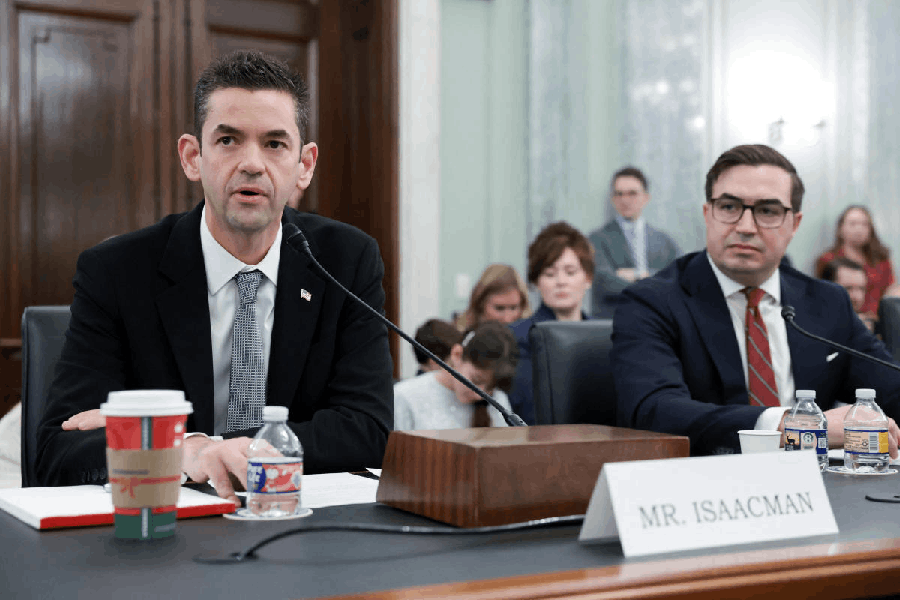 Jared Isaacman, U.S. President Donald Trump's nominee to be administrator of the National Aeronautics and Space Administration (NASA), and Steven Haines, nominated to be Assistant Secretary of Commerce for Industry and Analysis, testify during a Senate Commerce, Science, and Transportation confirmation hearing on Capitol Hill in Washington, D.C., U.S., December 3, 2025.