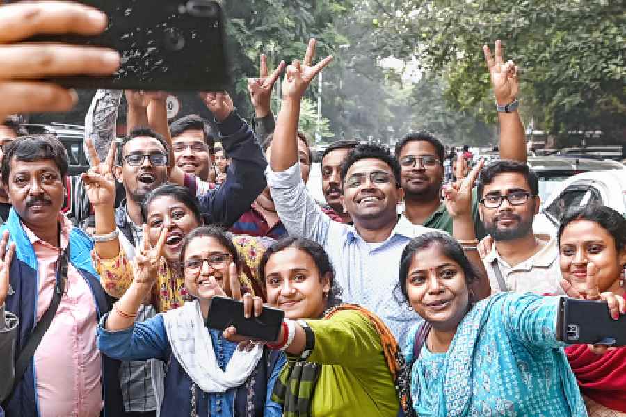 Primary teachers celebrate the Calcutta High Court verdict on Wednesday