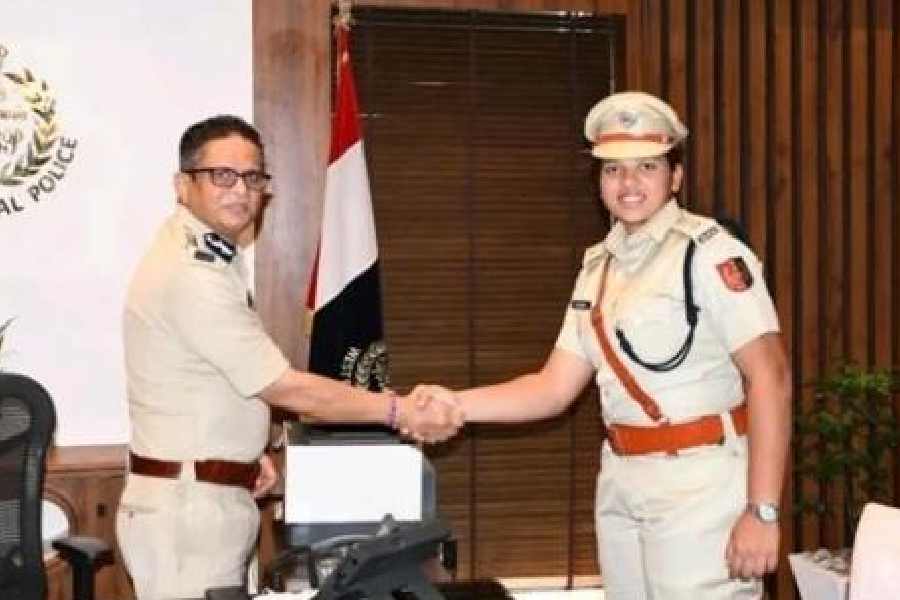 Richa Ghosh greets Bengal's DGP Rajeev Kumar on Wednesday.