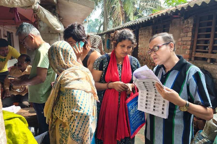 A BLO visits a home in East Midnapore's Contai with enumeration forms last month