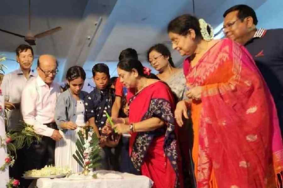 Krishna Chakraborty and other dignitaries light the lamp at SOS Children’s Village in BK Block.