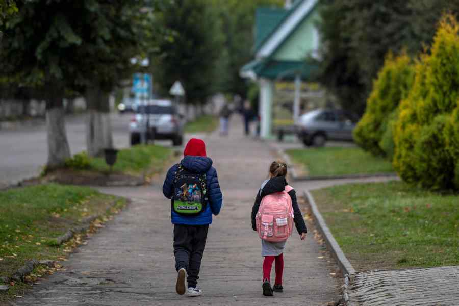 Children walk home after school, amid Russia's attack on Ukraine, in Hoshcha