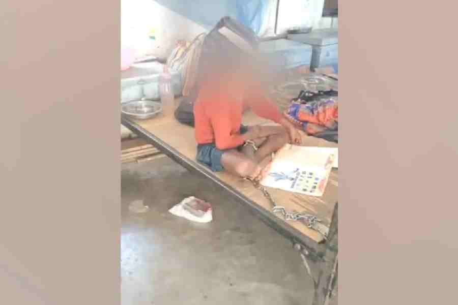 The schoolboy chained in his hostel room.