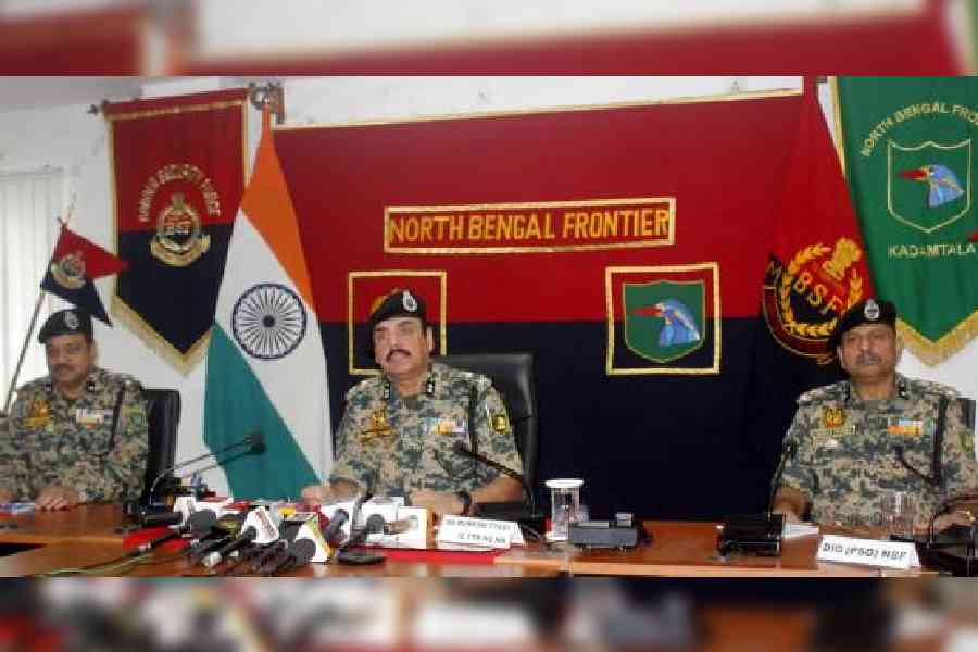 Mukesh Tyagi (centre), the inspector general of the BSF’s north Bengal frontier, addresses the media at Kadamtala near Siliguri on Thursday. Picture by Passang Yolmo