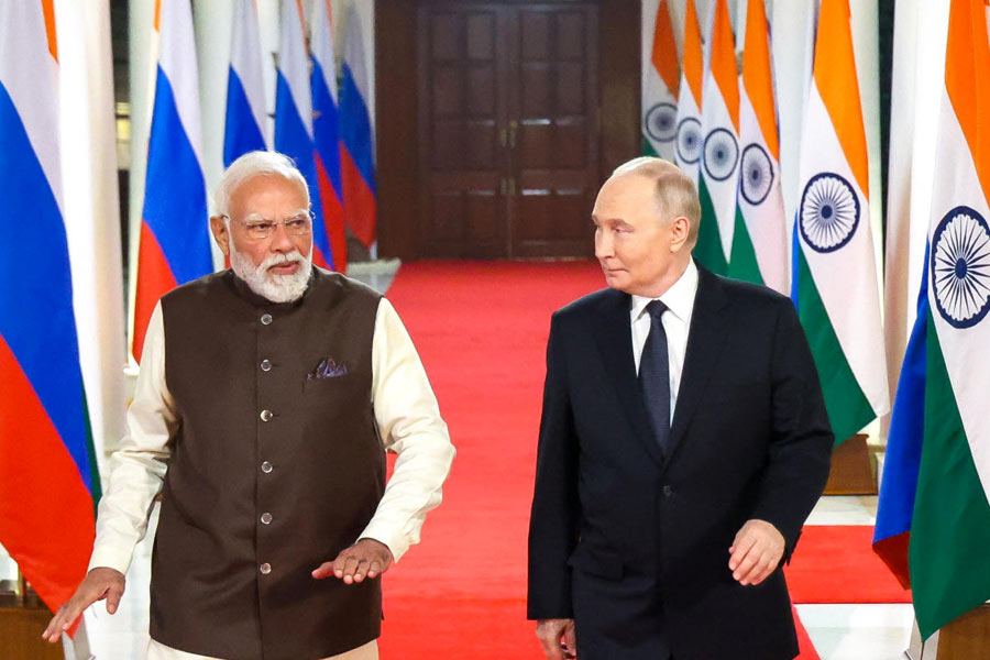 Russian President Vladimir Putin and Indian Prime Minister Narendra Modi arrive for an informal dinner at the Prime Minister's Residence in New Delhi, India December 4, 2025.