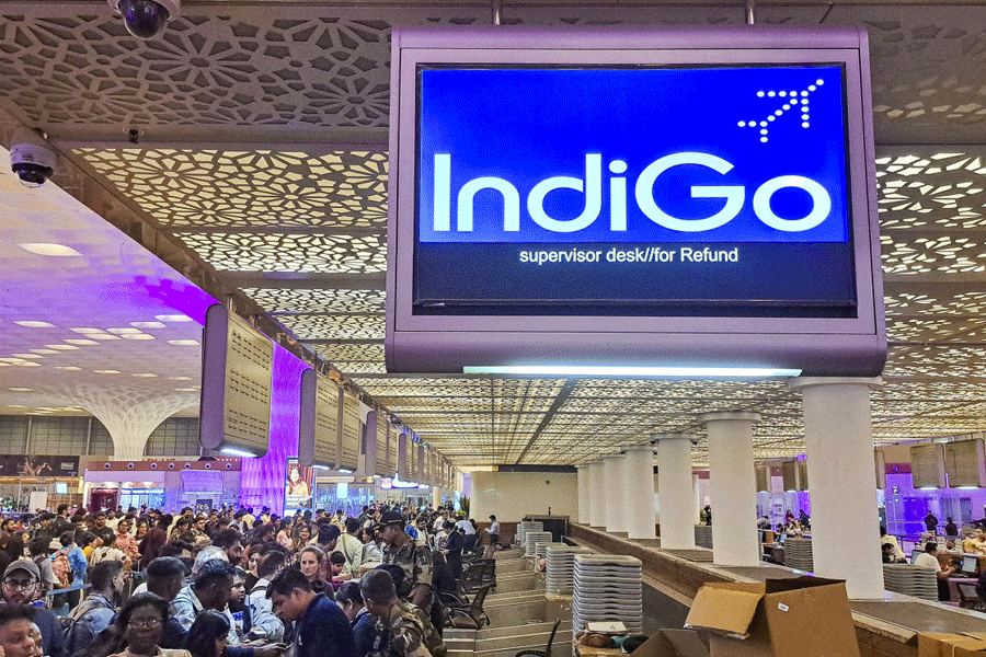 Stranded passengers at the IndiGo counter after several flights were cancelled at Chhatrapati Shivaji Maharaj International Airport, in Mumbai, Friday, Dec. 5, 2025.